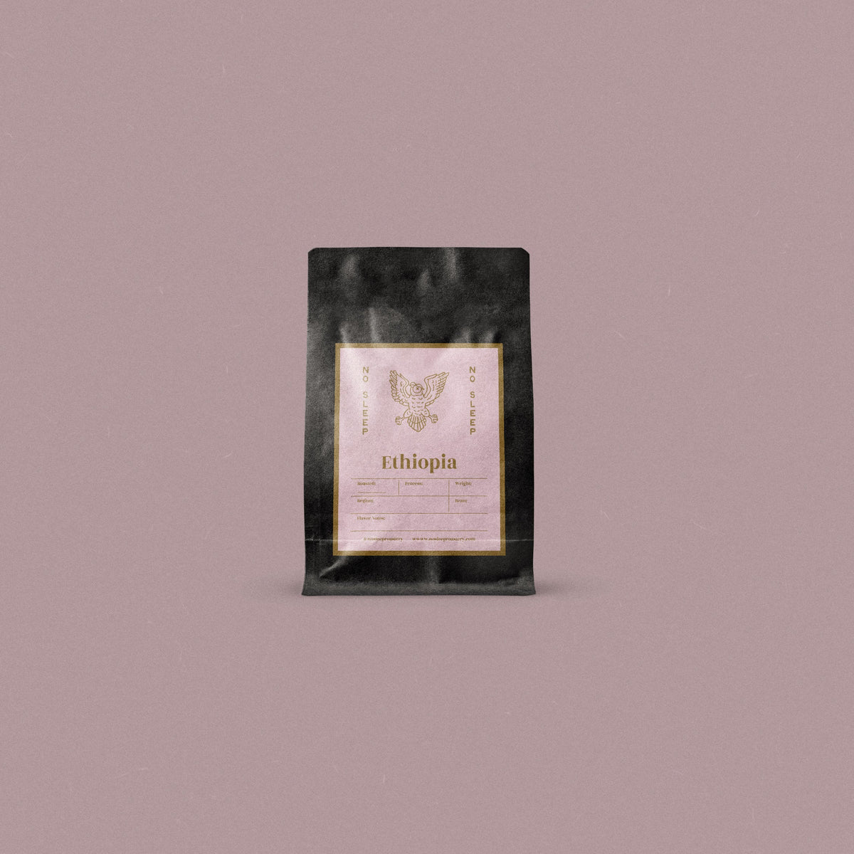 A single black coffee bag with a central cream label reading 'Ethiopia' and a owl logo, centered on a solid dusty mauve background.
