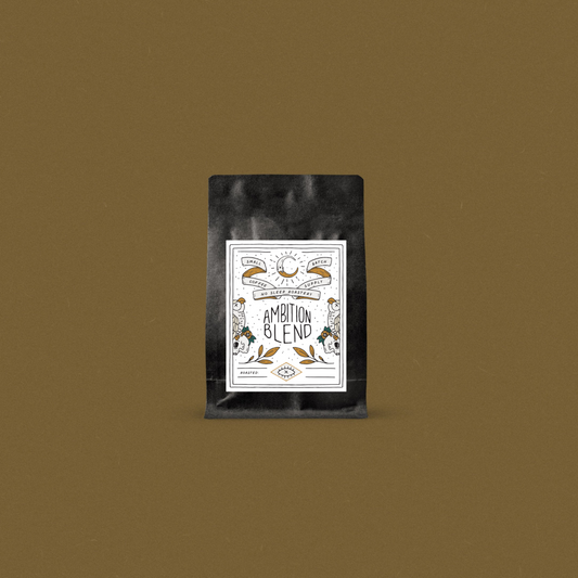 Fresh roasted coffee in a black bag with a designer label displayed on a bronze background